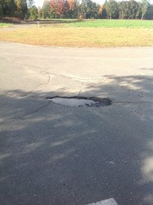 potholes sign of asphalt failure