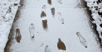 Sidewalk footprints in snow